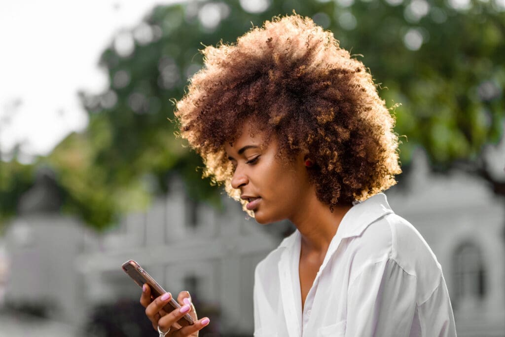 Woman on Cell Phone Online Notary Digital Signing
